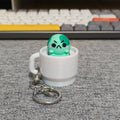 angyfrog in a mug clicker keychain