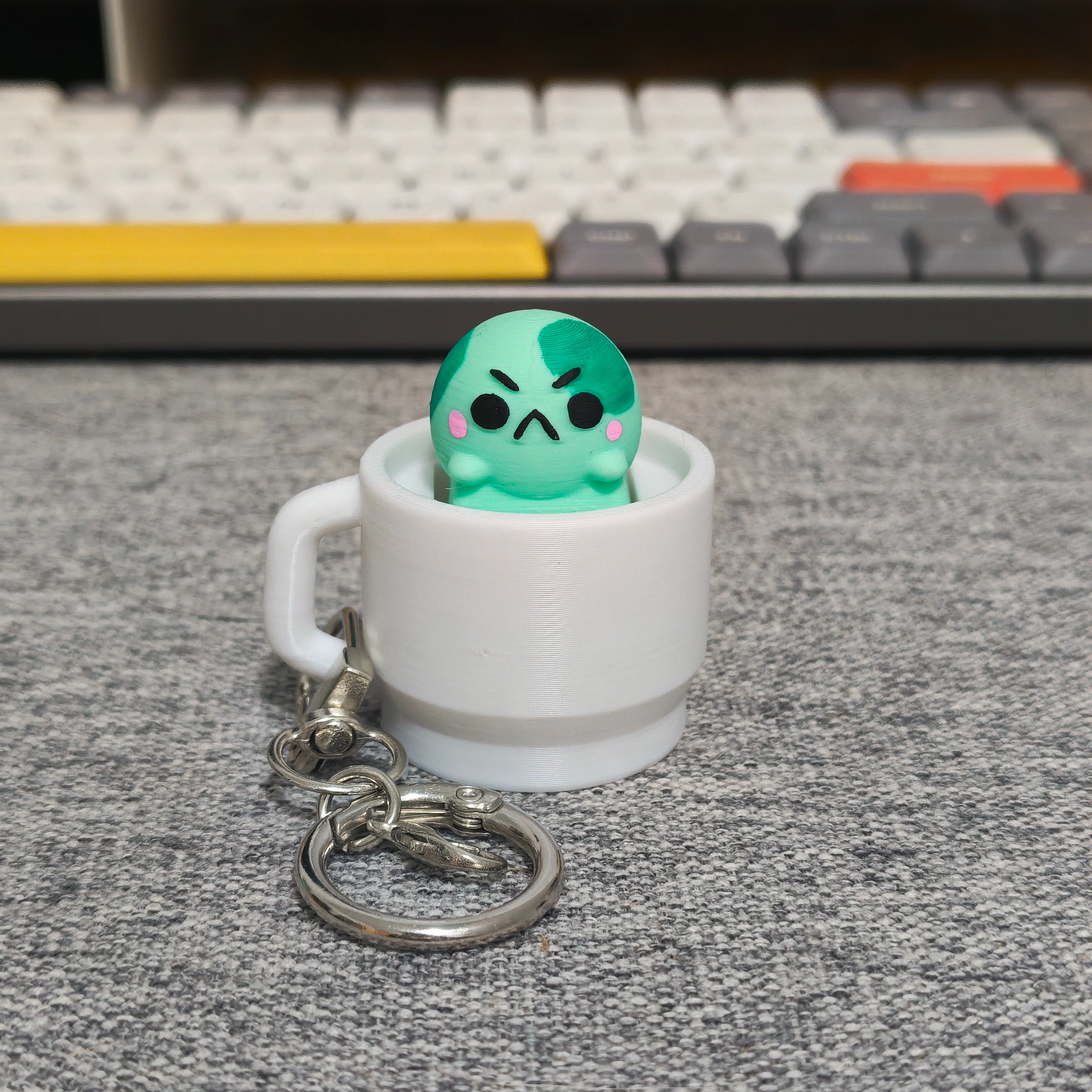 angyfrog in a mug clicker keychain