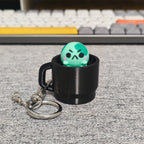 angyfrog in a mug clicker keychain