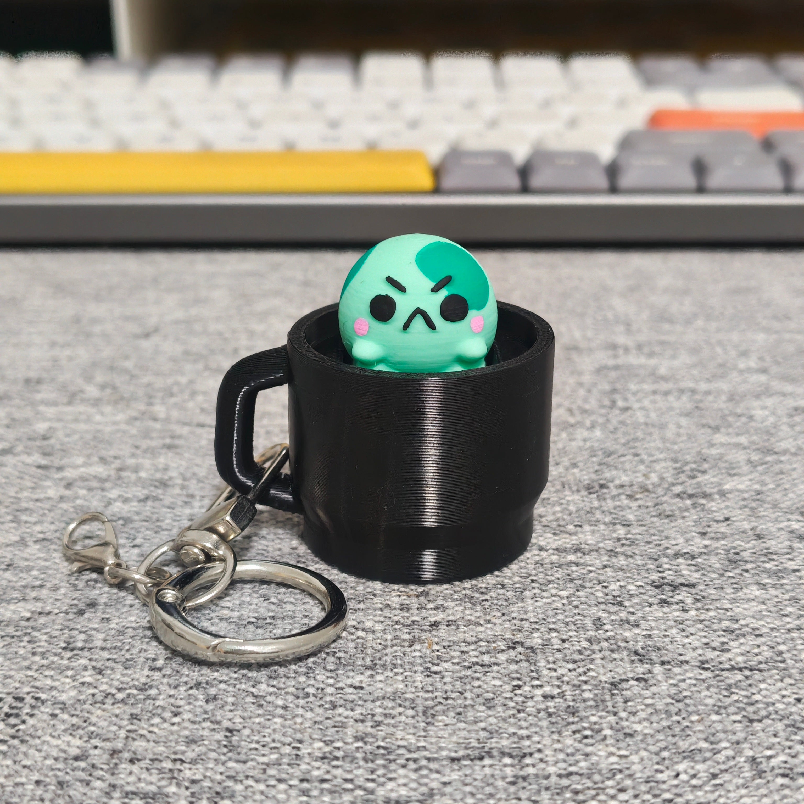 angyfrog in a mug clicker keychain